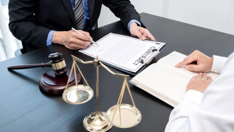 Structured notes fraud lawyer reviewing complex investment documents with client