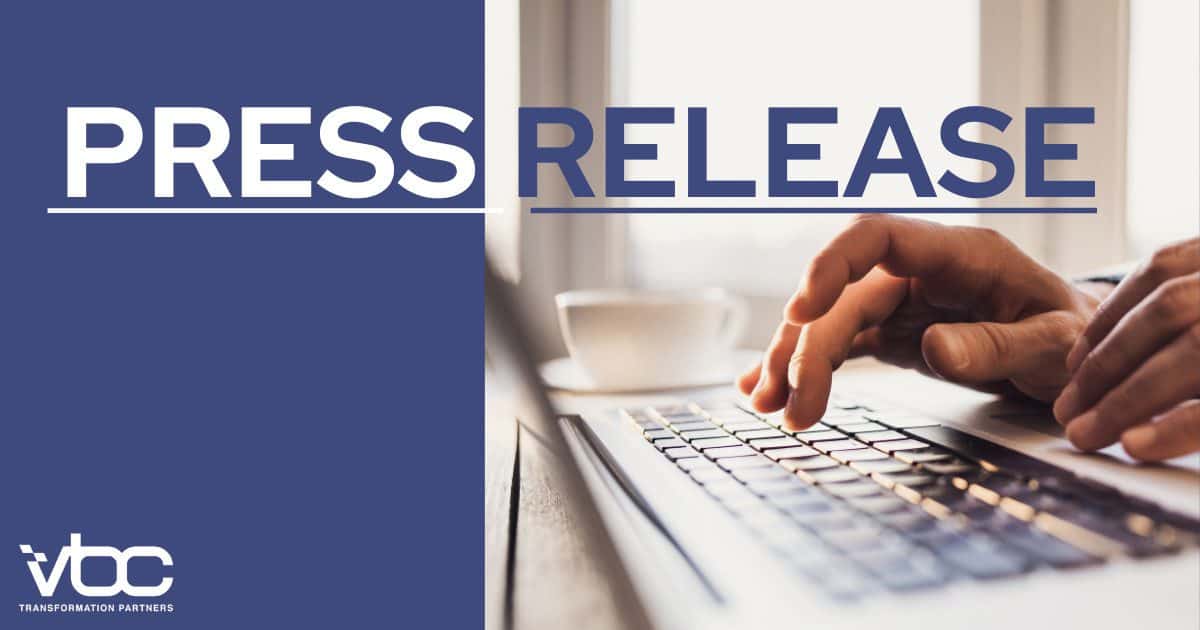 Hands typing on a laptop keyboard with the words "Press Release" prominently displayed above, highlighting VBC Transformation Partners' latest initiatives.