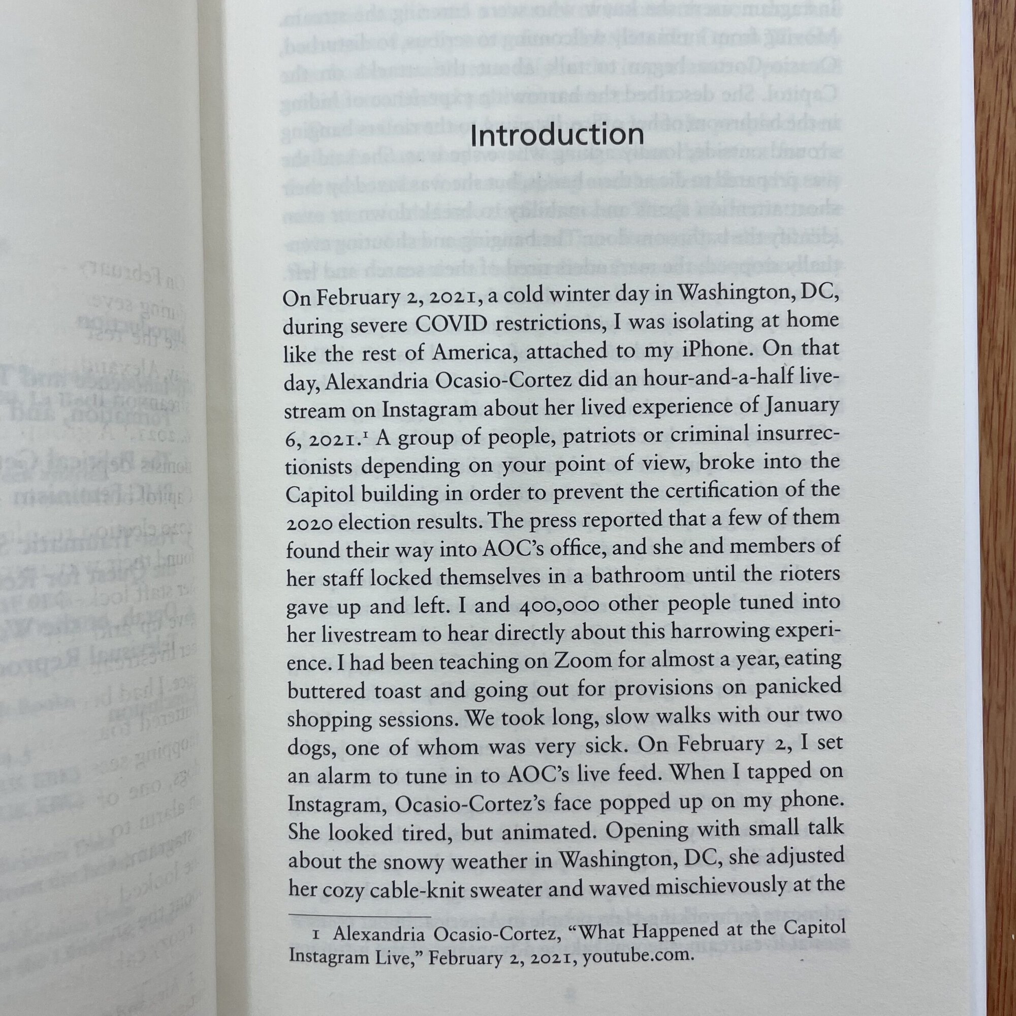 Photograph of a book page with the title 'Introduction' and a personal account of a winter day in Washington, DC, during COVID restrictions.