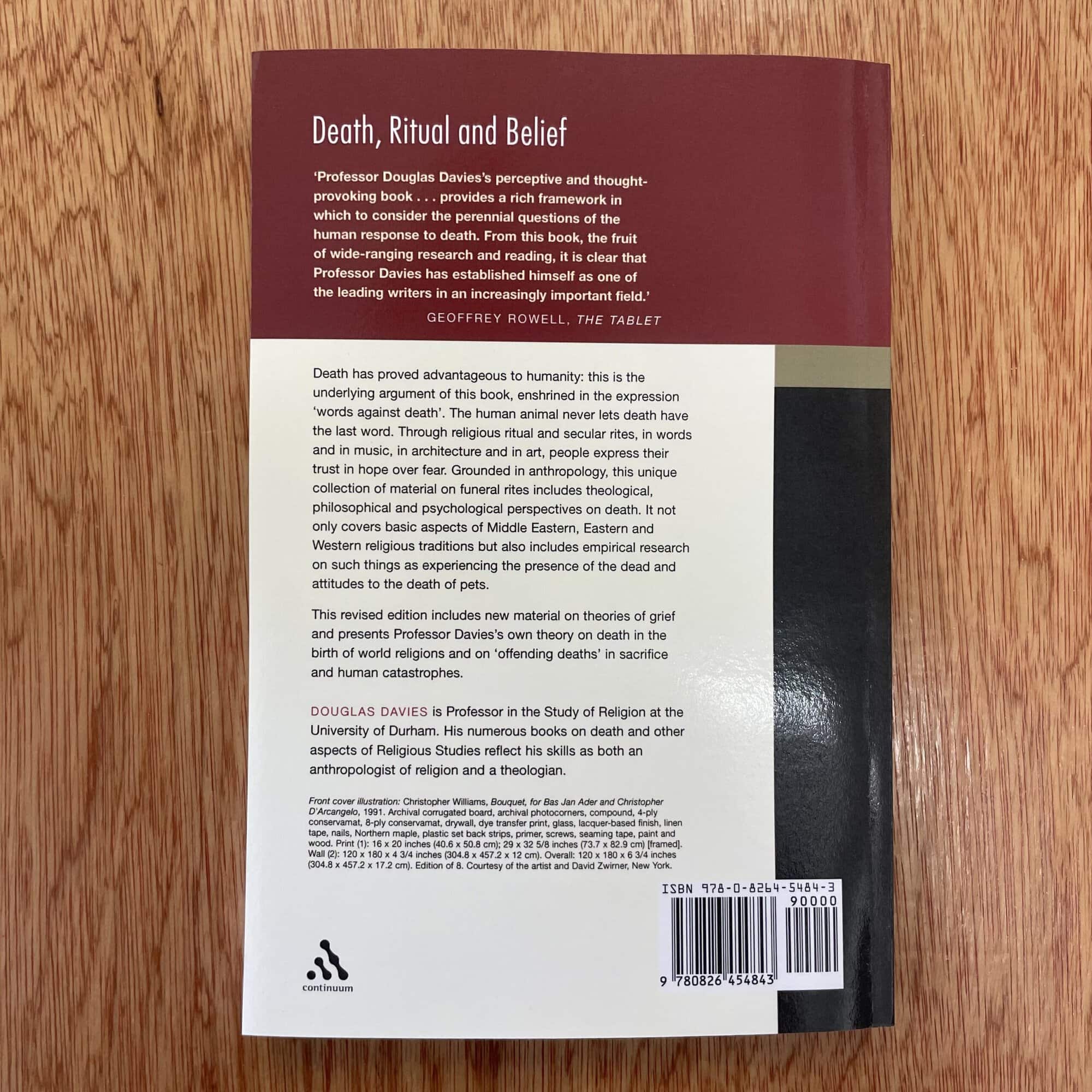 Close-up of the back cover of a book discussing death, ritual, and belief by Douglas Davies, with a barcode and publisher details.