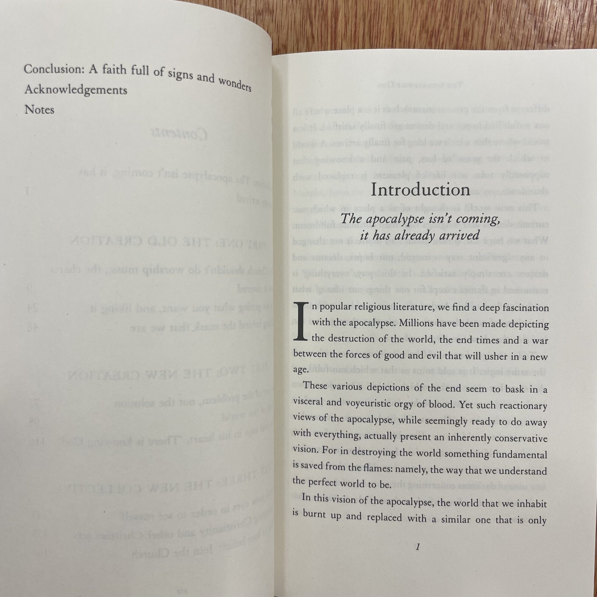Open book showing introduction page discussing apocalypse and cultural reflections.