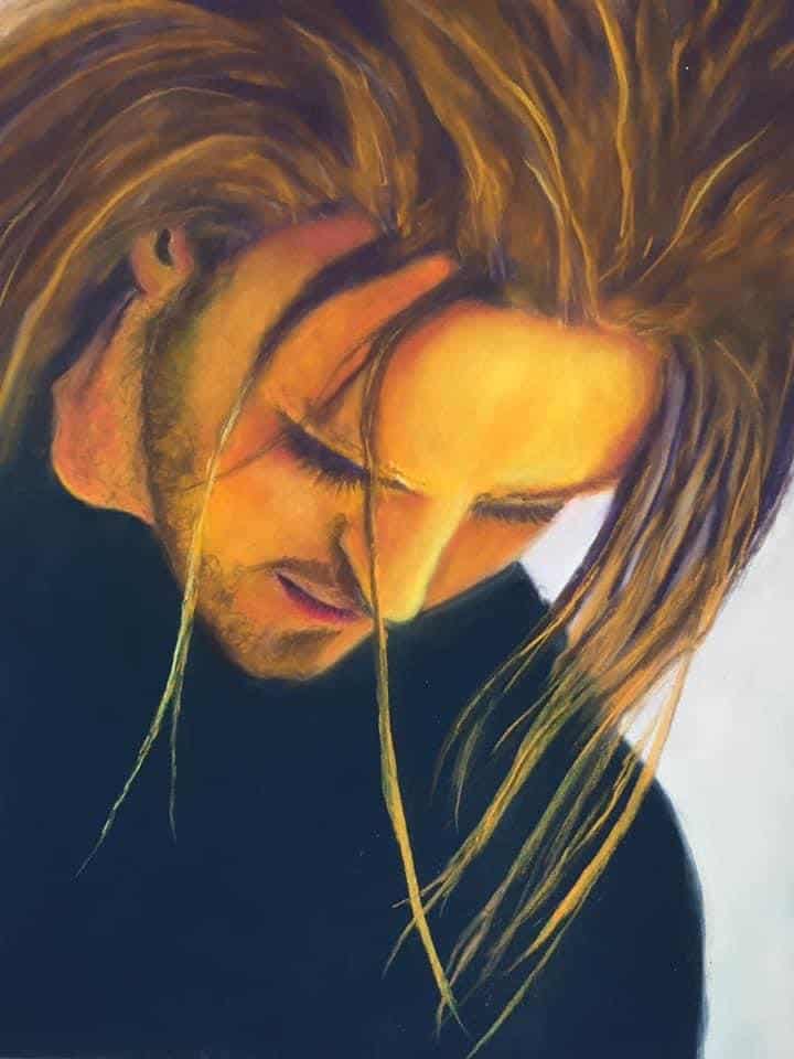 Pastel portrait of Michelle Hendrie, showcasing vibrant colours and detailed features.