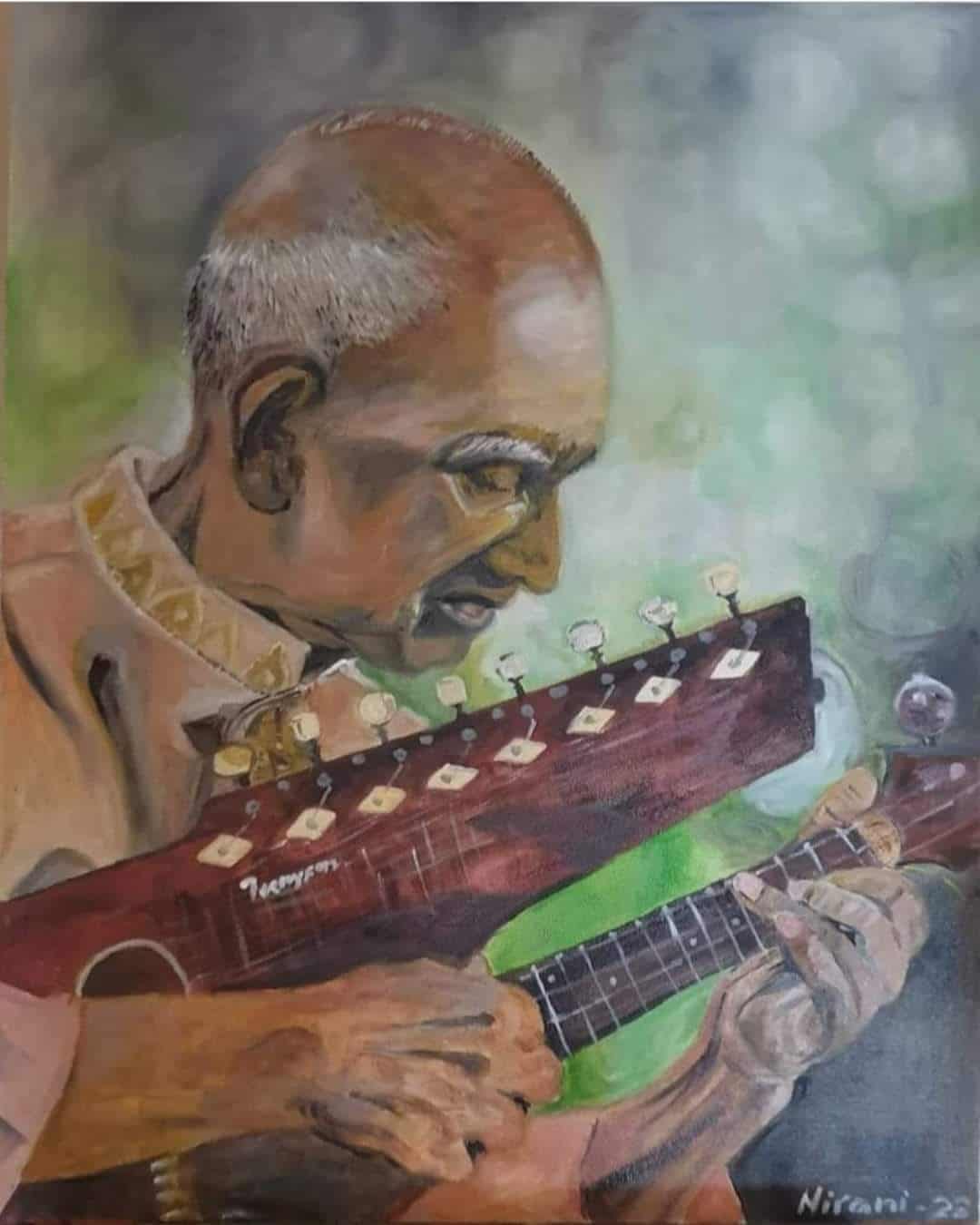 Portrait of Nirani Pathirage playing guitar, showcasing his musical talent and passion.