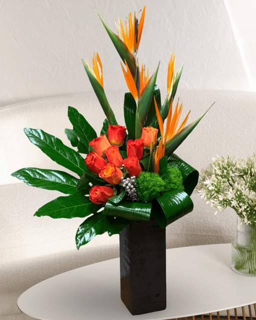 Las Vegas Flower Haven" is a desert oasis with a tropical twist. Featuring vibrant Birds of Paradise, orange roses, and elegant Monstera leaves, it's a lush escape in the heart of Las Vegas. Nature's beauty, redefined.