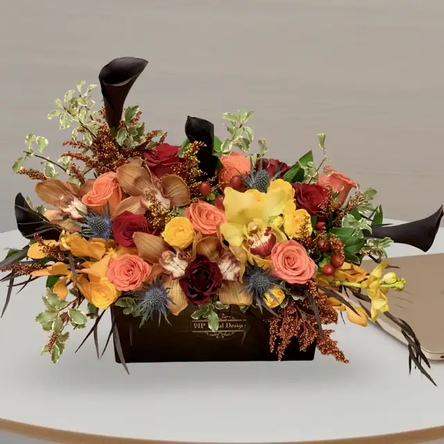 Vibrant floral arrangement with roses, orchids, and greenery in a black VIP Floral box, perfect for special occasions and flower delivery in Las Vegas.