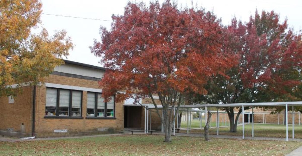 School building with autumn trees in Ladonia, Texas.
