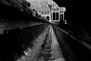 Clean gutter with rain water flowing freely