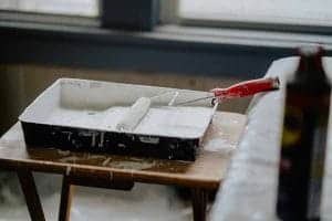 A close up of a painting and decorating roller and tray