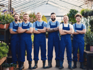 An image of a team of landscape gardeners in a greenhouse
