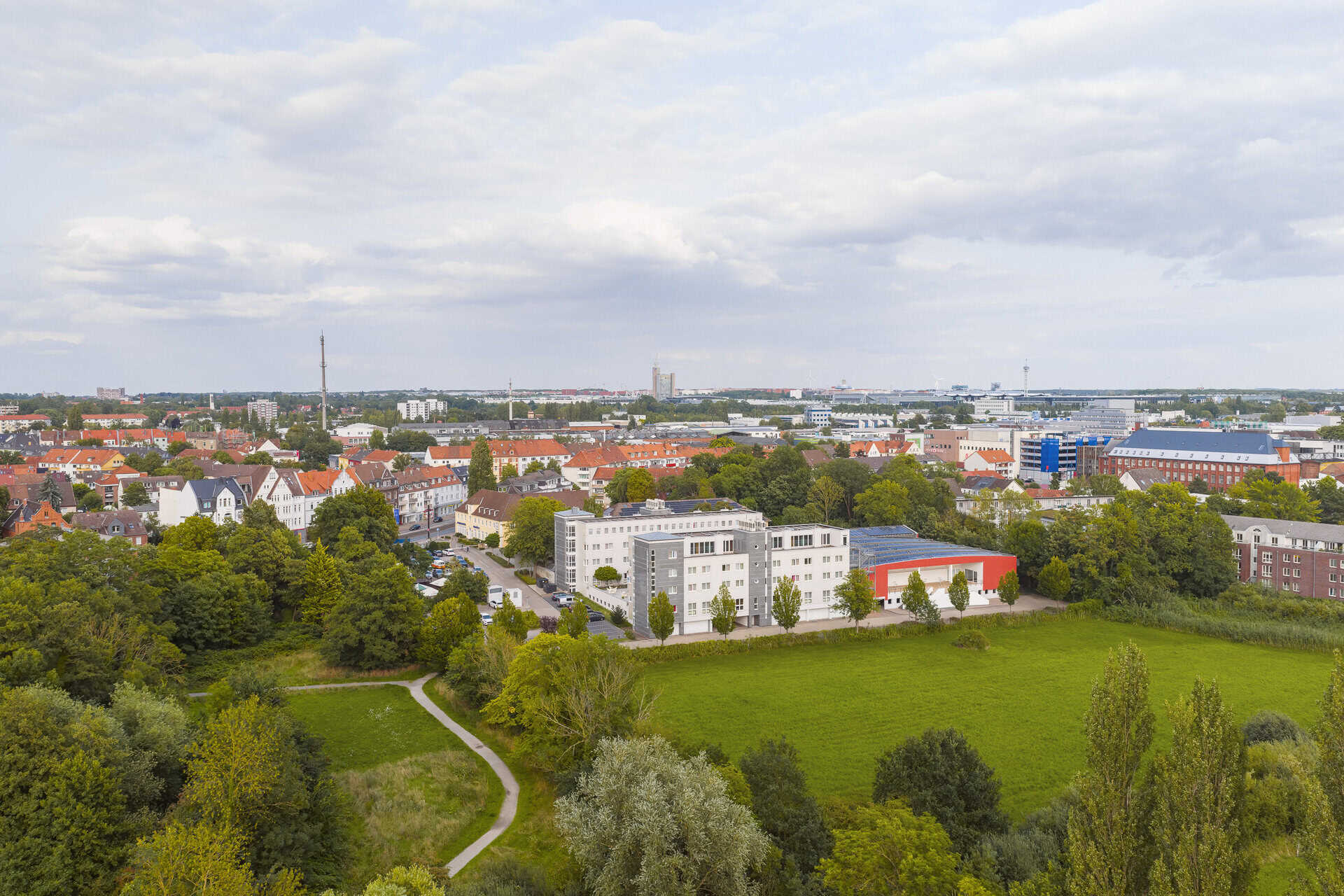 A bird's eye view of Hotel Wienekce XI, surrounded by the adjacent nature reserve.