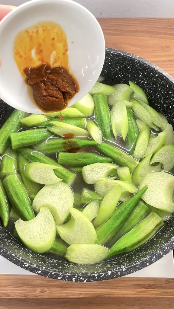Add tom yum paste