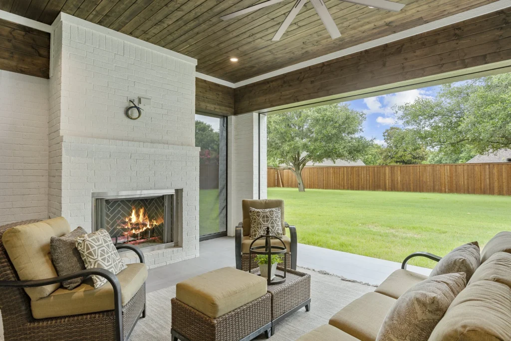 Luxury outdoor space with retractable screens and fireplace in Southlake, Texas
