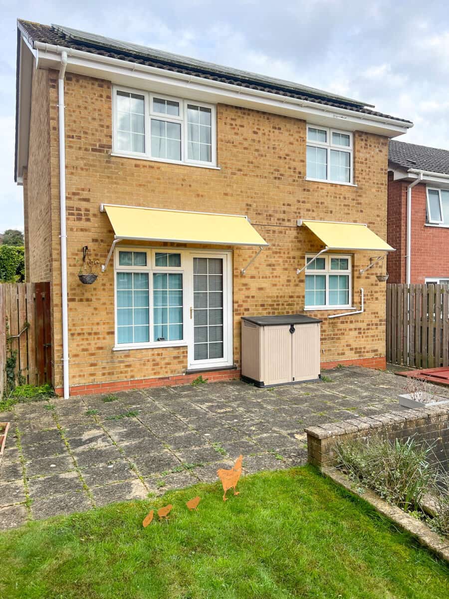 Drop arm awning