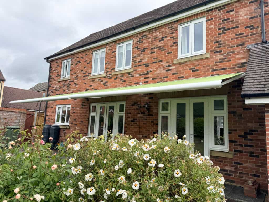 Retractable garden awning providing shade and comfort for homeowners in Andover