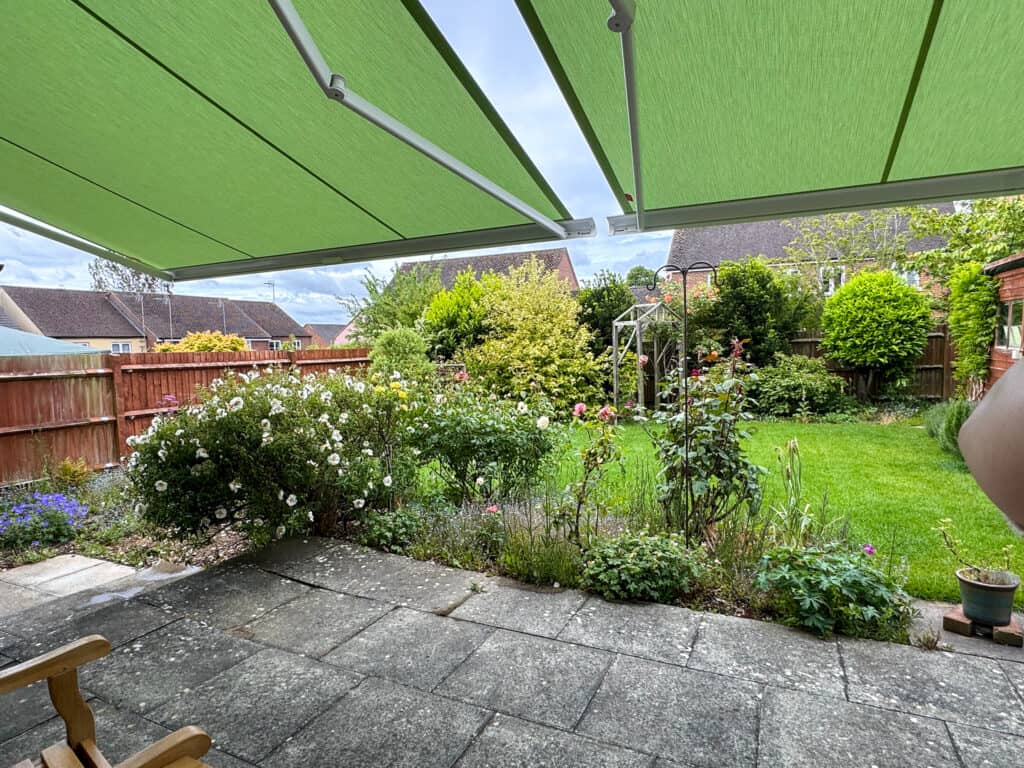 Shaded seating area beneath a bespoke Weinor awning installation in Andover