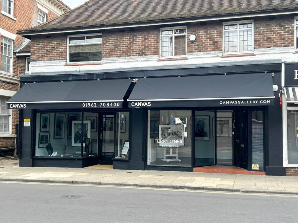 Commercial shopfront awning providing shelter and branding for a Hampshire business