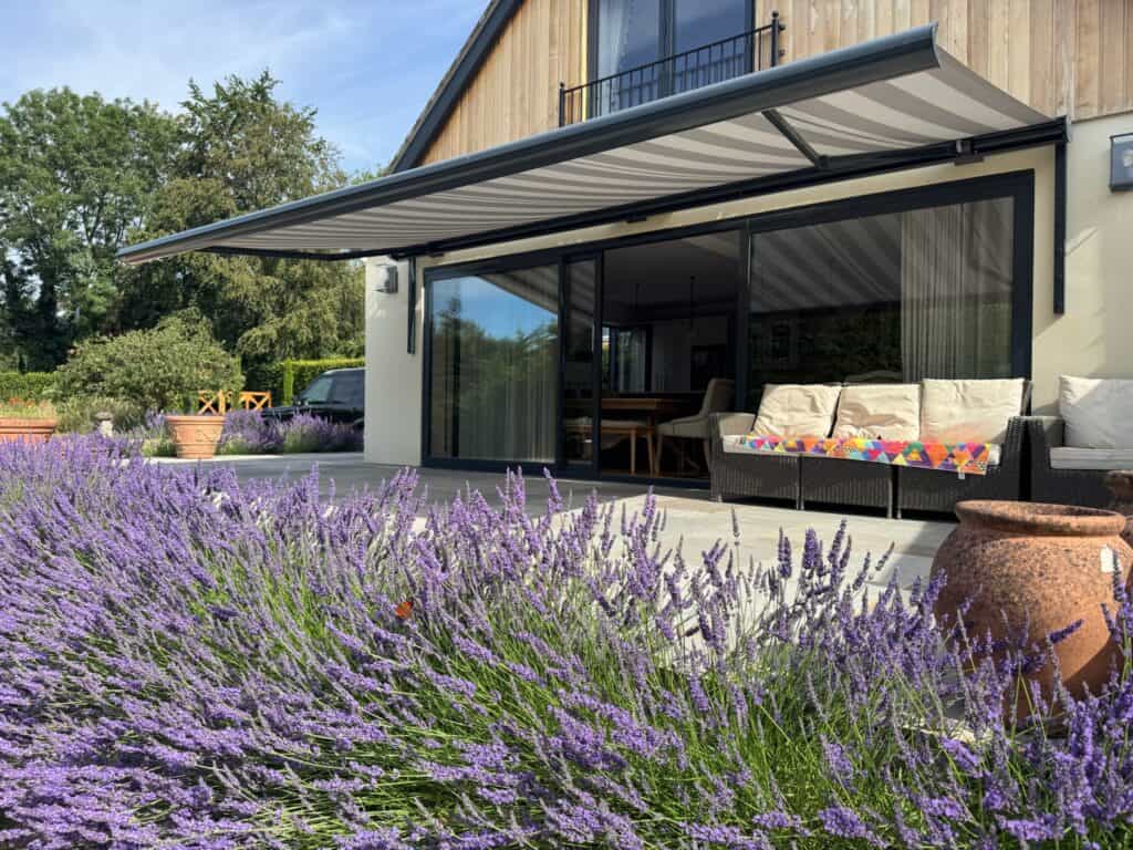 Patio awning shielding bifold doors from sun