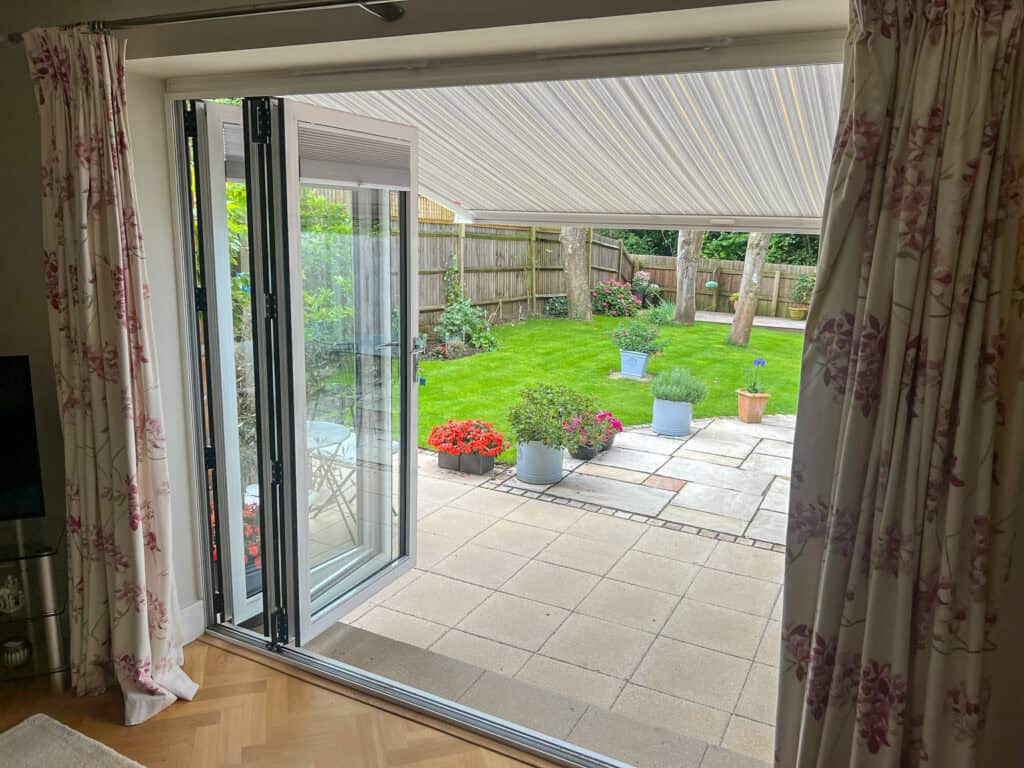 Awning extended over patio outside bifold doors