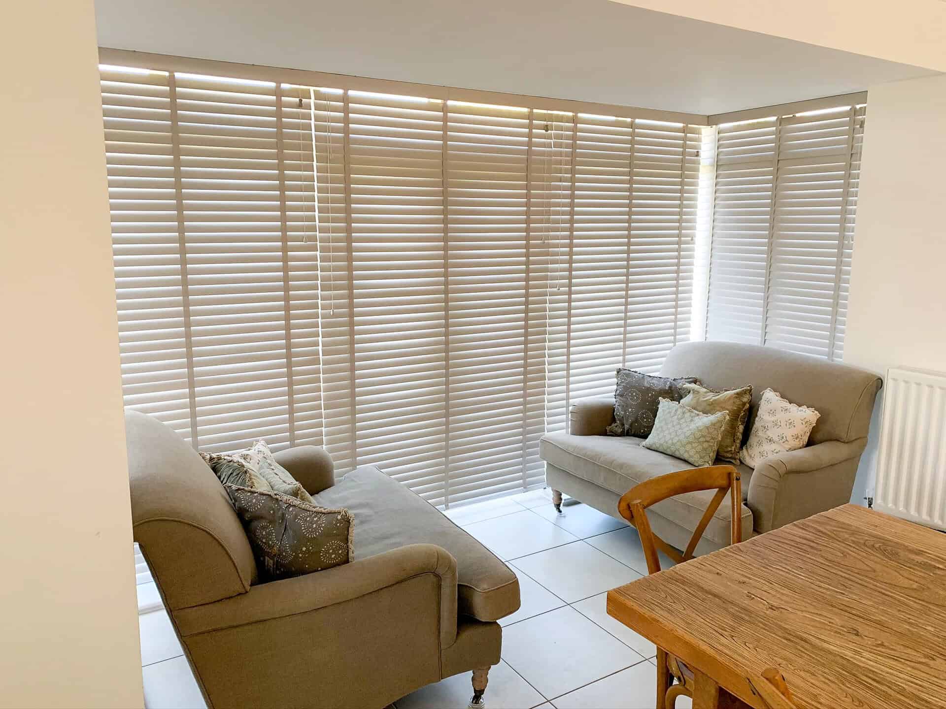 Hard Wood Venetian blinds in a dining room and patio doors in Medstead Alton Hampshire