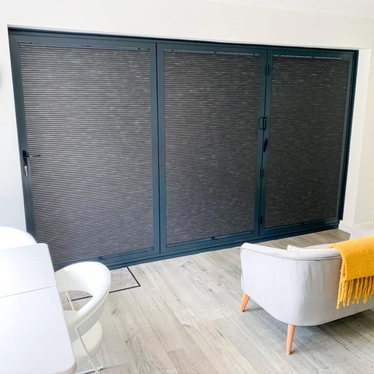 Blackout cellular pleated blinds to bifold doors in Basingstoke Hampshire
