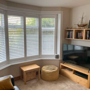 Made-to-measure plantation shutters fitted to a bay window in Winchester