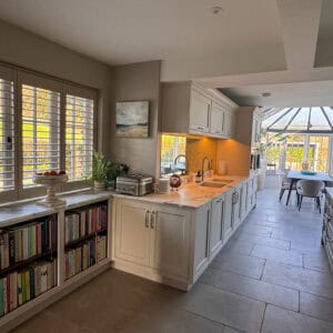 Full-height plantation shutters providing privacy and light control