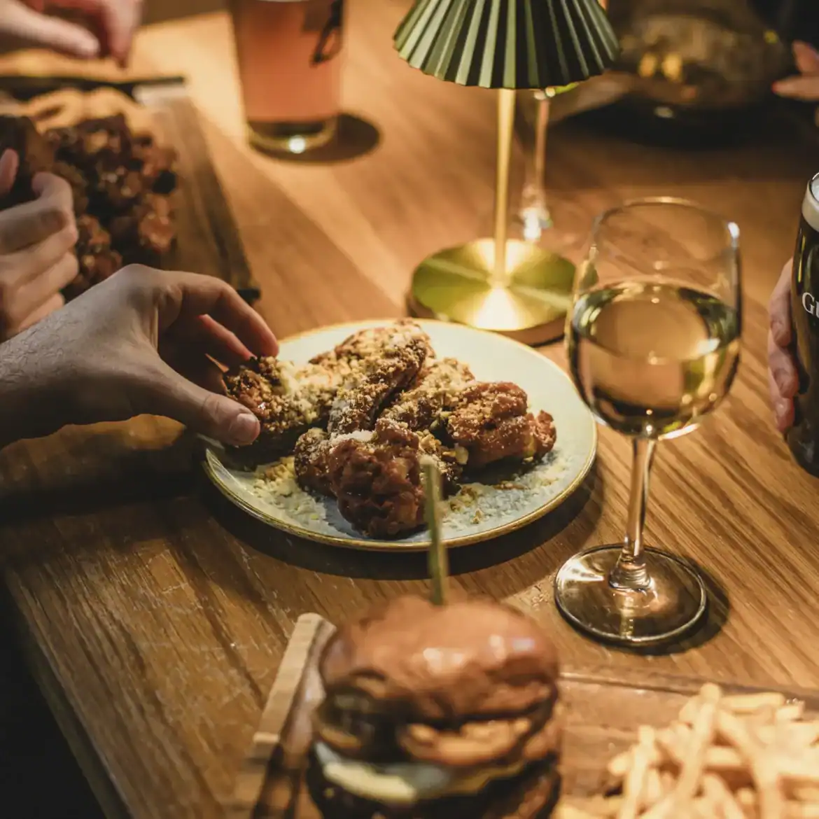 Belushi's Korean glazed chicken tenders shared with craft beer and wine, globally inspired World Cup match day food