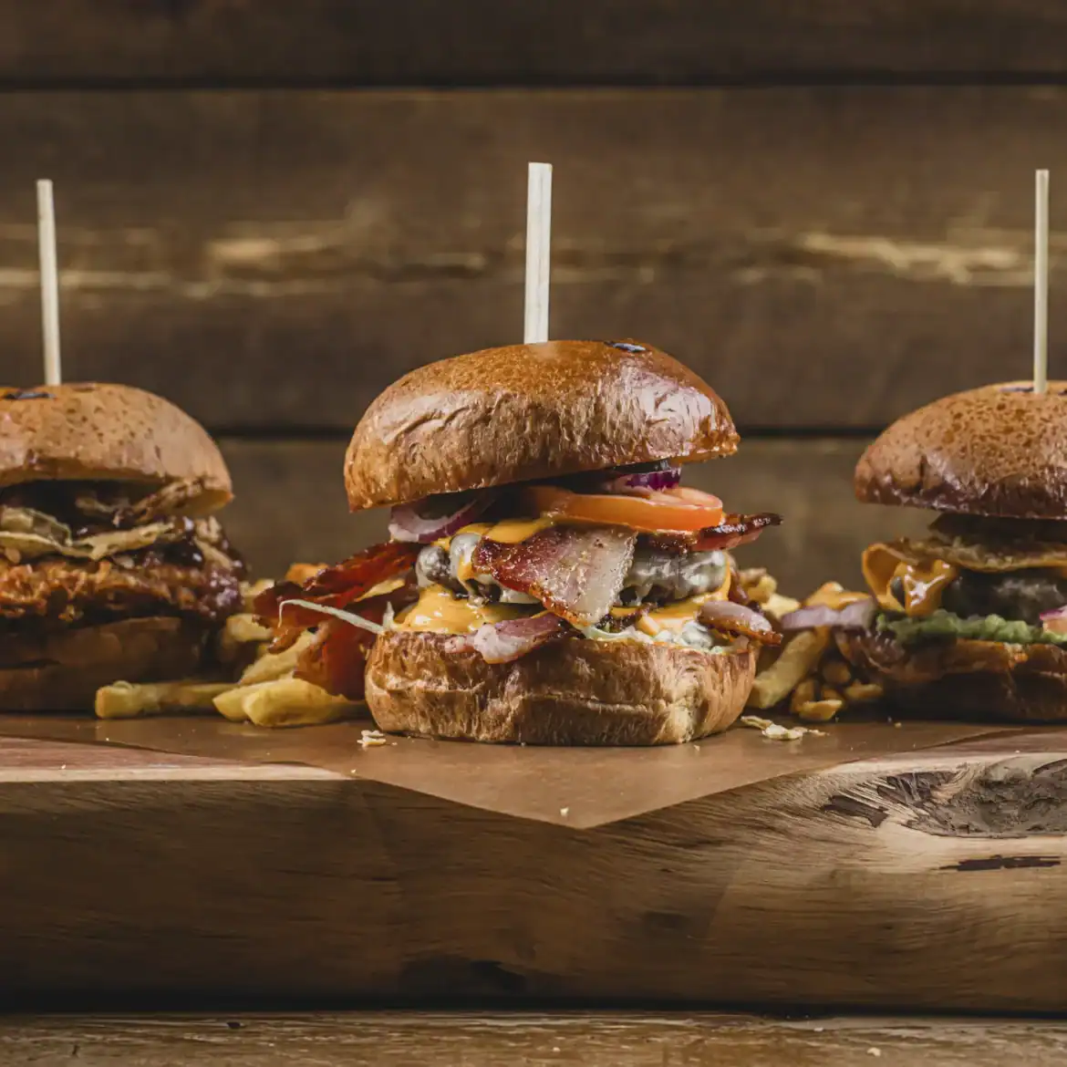 Belushi's loaded burger menu featuring multiple globally inspired burgers with fries, the ultimate World Cup sports bar food