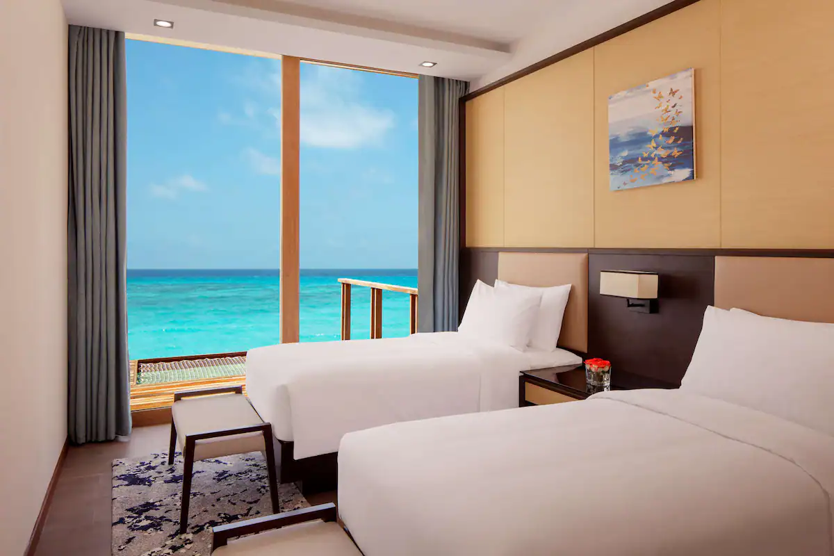 Three Bedroom Overwater Villa - Pool and Lagoon View / Three Bedroom Overwater Villa - Pool and Sunset View