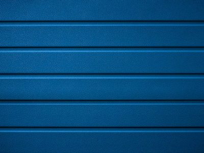Blue textured metal cladding for contemporary architectural design.