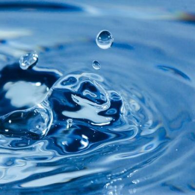 High-resolution image of water splash highlighting fluid dynamics and transparency, perfect for architecture and engineering visuals.