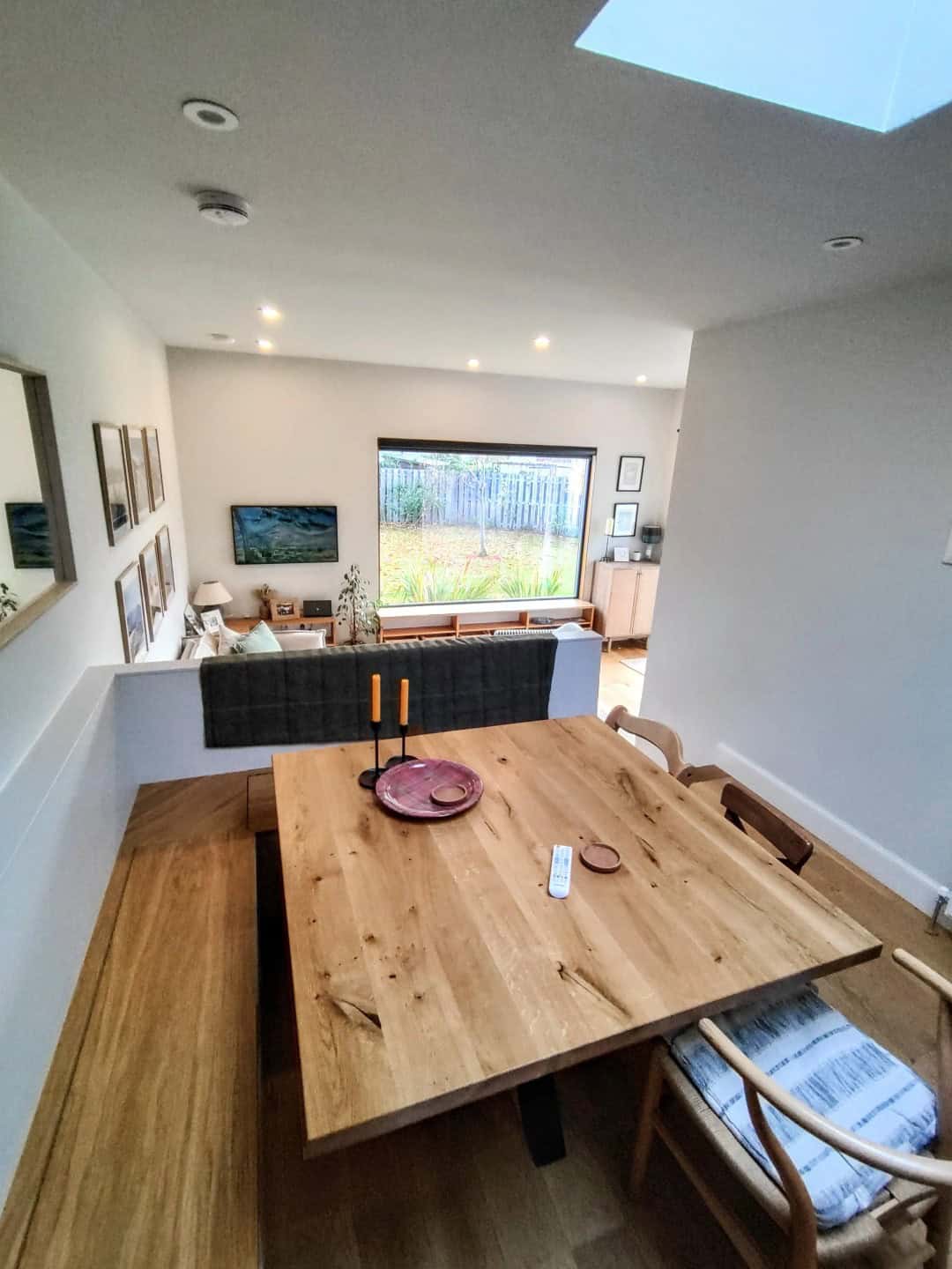 Bright living room with large window, contemporary decor, and stylish furniture.