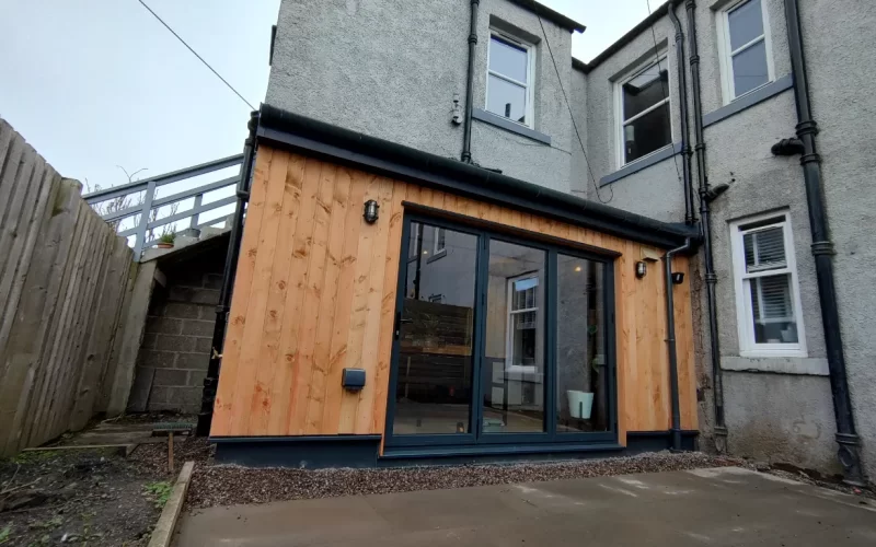 Elegant garden transformation with timber and glass, enhancing outdoor space for modern living.