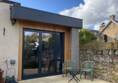 High-quality garden room with modern design, double-glazed doors, and natural wood finishing.