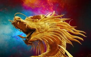 Intricate golden dragon sculpture with fiery background.