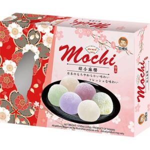 Asiatischer Lebensmittelladen, Mochi in verschiedenen Farben auf schwarzem Teller.
