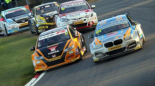 Image of Weekly Racing + Crown Vics Meet & Greet at Intermission Bike Night at Lafayette County Speedway. Image Source: https://upload.wikimedia.org/wikipedia/commons/thumb/6/63/2016_British_Touring_Car_Championship_Brands_Hatch_GP_30245906692.jpg/500px-2016_British_Touring_Car_Championship_Brands_Hatch_GP_30245906692.jpg