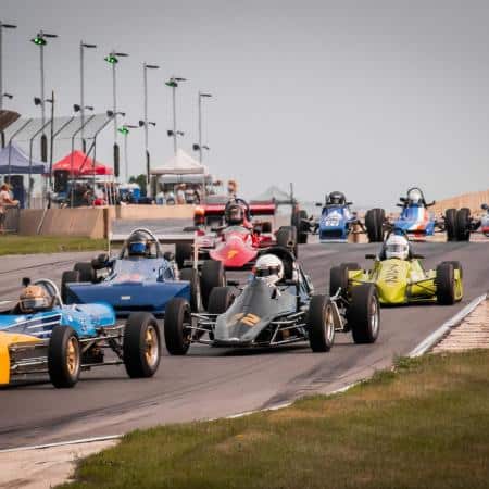 Image of XPEL Grand Prix Racer Appreciation Presented by AMR at Road America. Image Source: https://www.roadamerica.com/sites/main/files/imagecache/square_small/main-images/day_3_complete-28.jpg