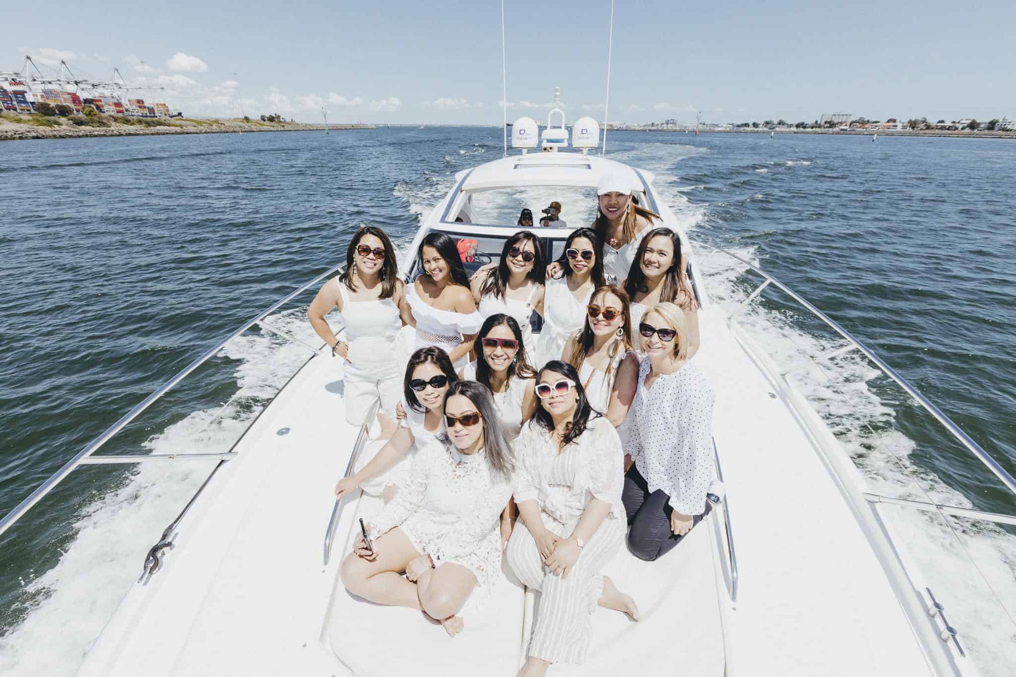 Ladies celebrating on a Sunseeker yacht during a Melbourne party boat cruise