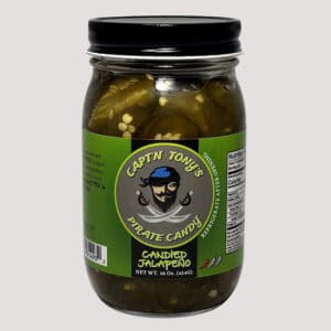Jalapeños candied with sweet glaze in a glass jar, perfect for spicy-sweet flavor.