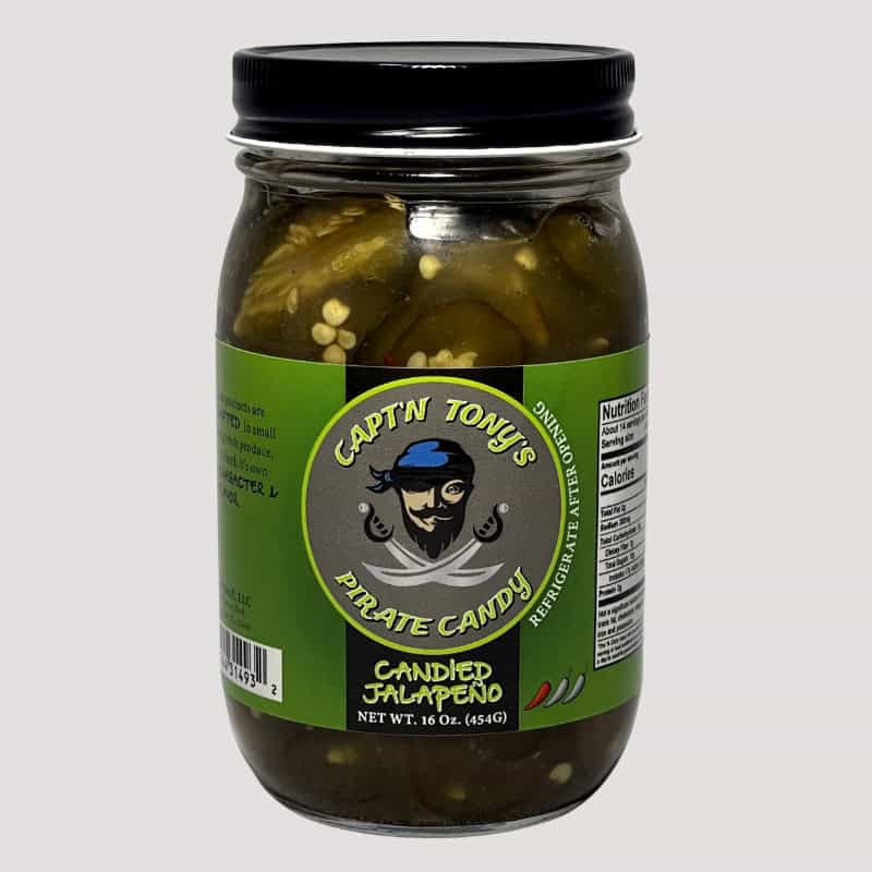 Jalapeños candied with sweet glaze in a glass jar, perfect for spicy-sweet flavor.