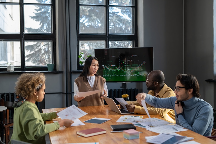 Team in a meeting reviewing documents