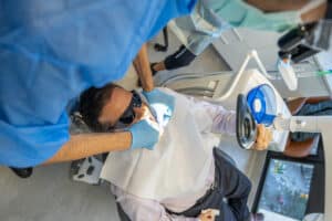 dentist demonstrating flossing to a patient at a brisbane cbd dentist