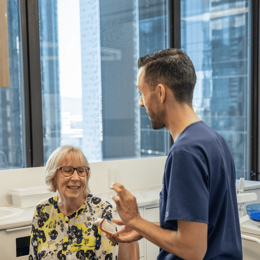 Dental implant consultation in Brisbane CBD – patient discussing treatment options with dentist