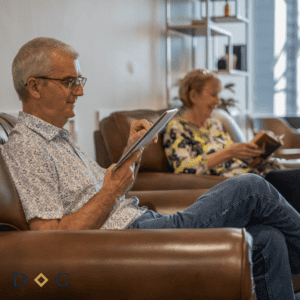 patient in dental waiting room filling out medical history form