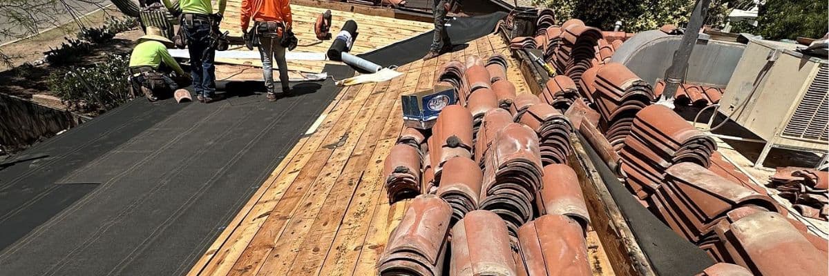House in a process of tile roof roof replacement in San Antonio