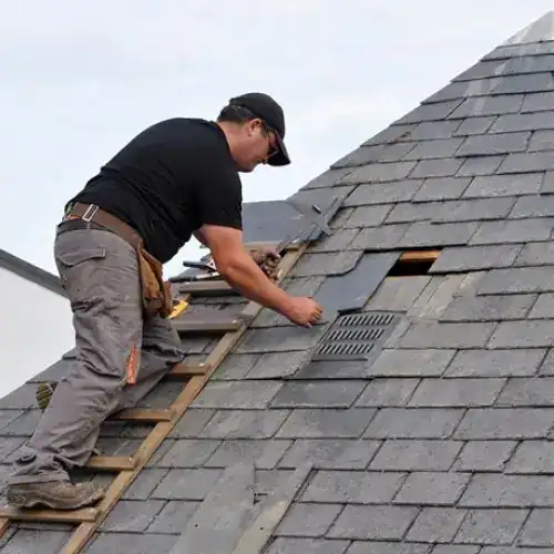 Roofing professional removing old shingles and installing new vent on steep residential roof, demonstrating roof replacement San Antonio by Dolan Roofing & Construction