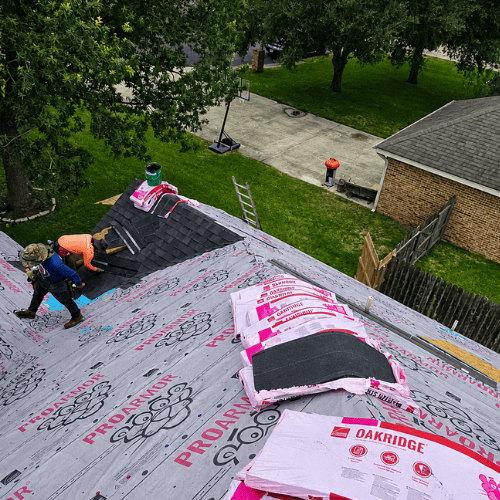 Roofing crew installing underlayment and shingles on a residential roof, supporting the best roofing company San Antonio service in San Antonio by Dolan Roofing & Construction.