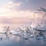 Broken glass meaning shown through shattered glass reflecting soft light, symbolizing spiritual signs, emotional release, and transformation.