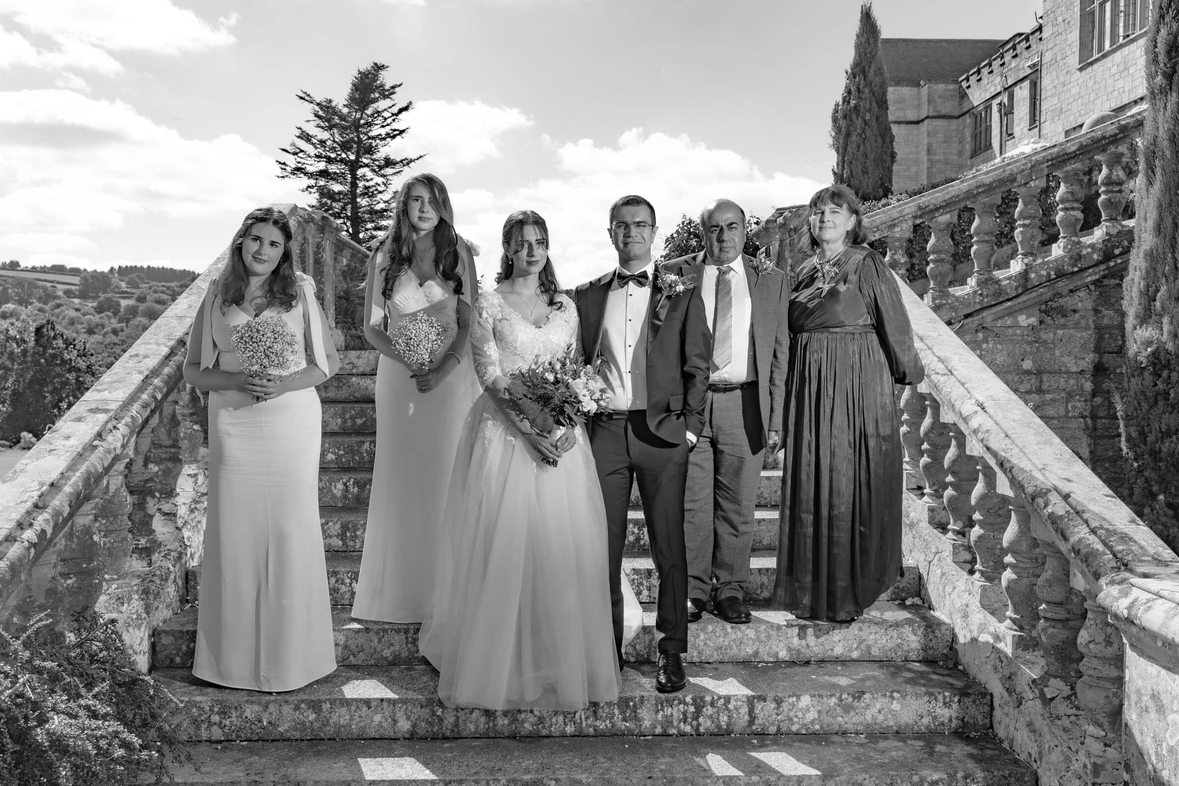 Louise + Amjad | Bovey Castle Micro Wedding, Dartmoor 19 Louise and Amjad Bovey Castle micro wedding photography — group photo on the steps